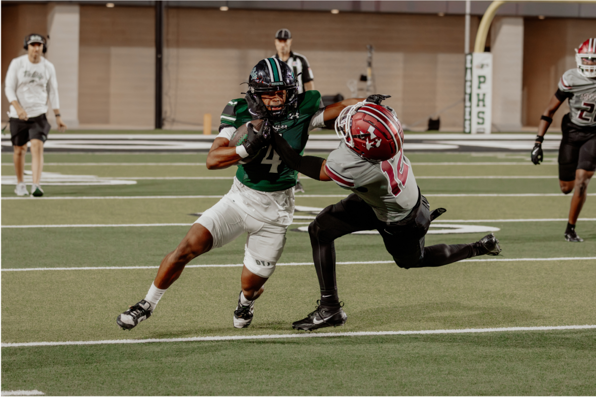 One foot in front of the other, senior Leo Anguiano attempts to stop his opponent, and run to the other side of the field. This marks Anguiano's fourth year in the program. The first game will be against Austin Westlake on Aug. 28 at 7 p.m.