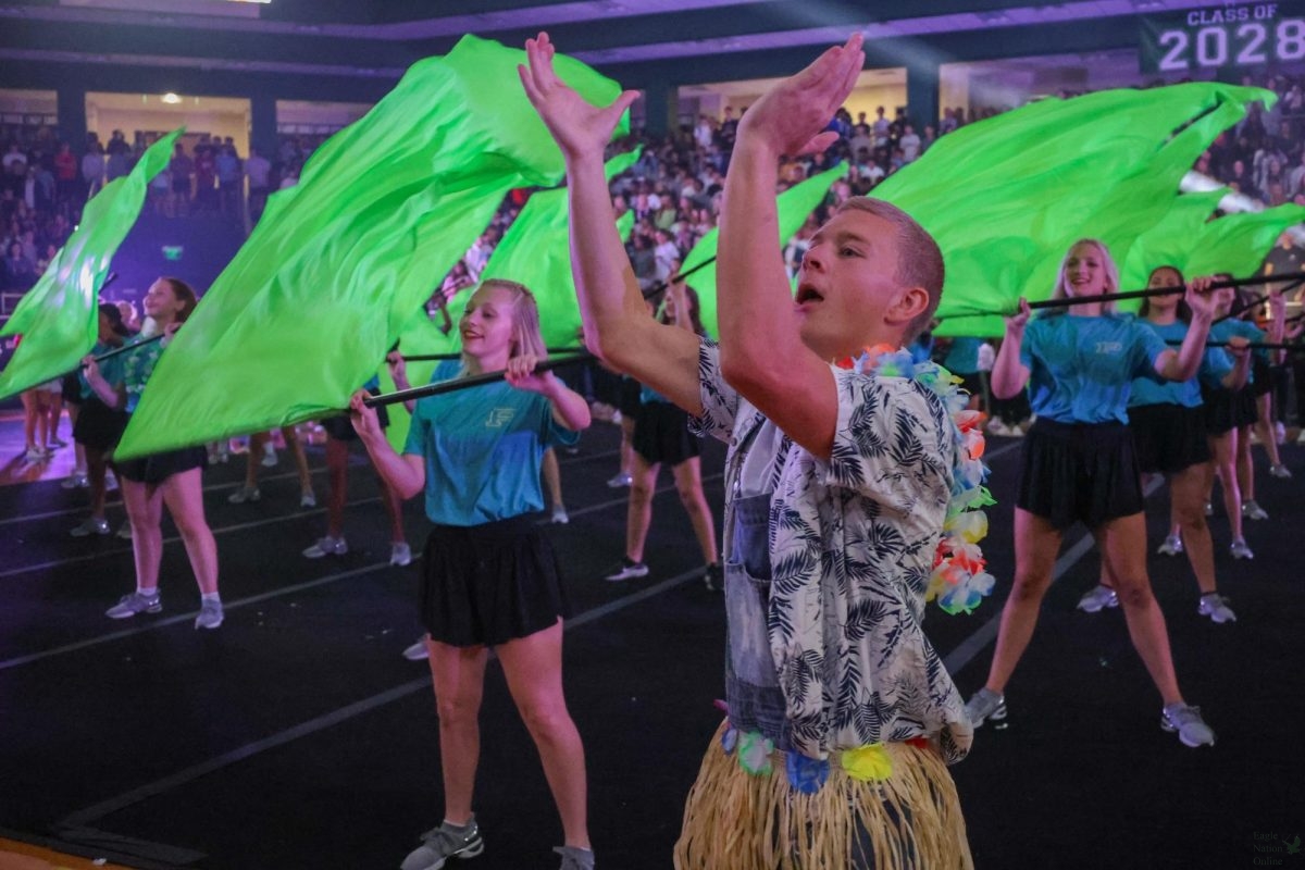 As the color guard performs its routine, junior spirit leader and sophomore Nathanial Crabtree claps to encourage the audience. The spirit leaders usually have a week before the pep rally to officially decide what they want to do at the event. "We figured out Tuesday what we're running through, and then Thursday, we met up for advisory and switched it up," Crabtree said. "We had lots of last minute changes."