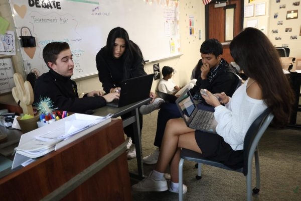 Eyes on the screen, senior Mahnoor Waqas, along with her teammates on the varsity debate team, prepares for their first tournament at Princeton High School. "With the amount of work we’ve done, it should reflect in our performance at the tournament,” Waqas said. "I believe everyone will be at the top of their game!"