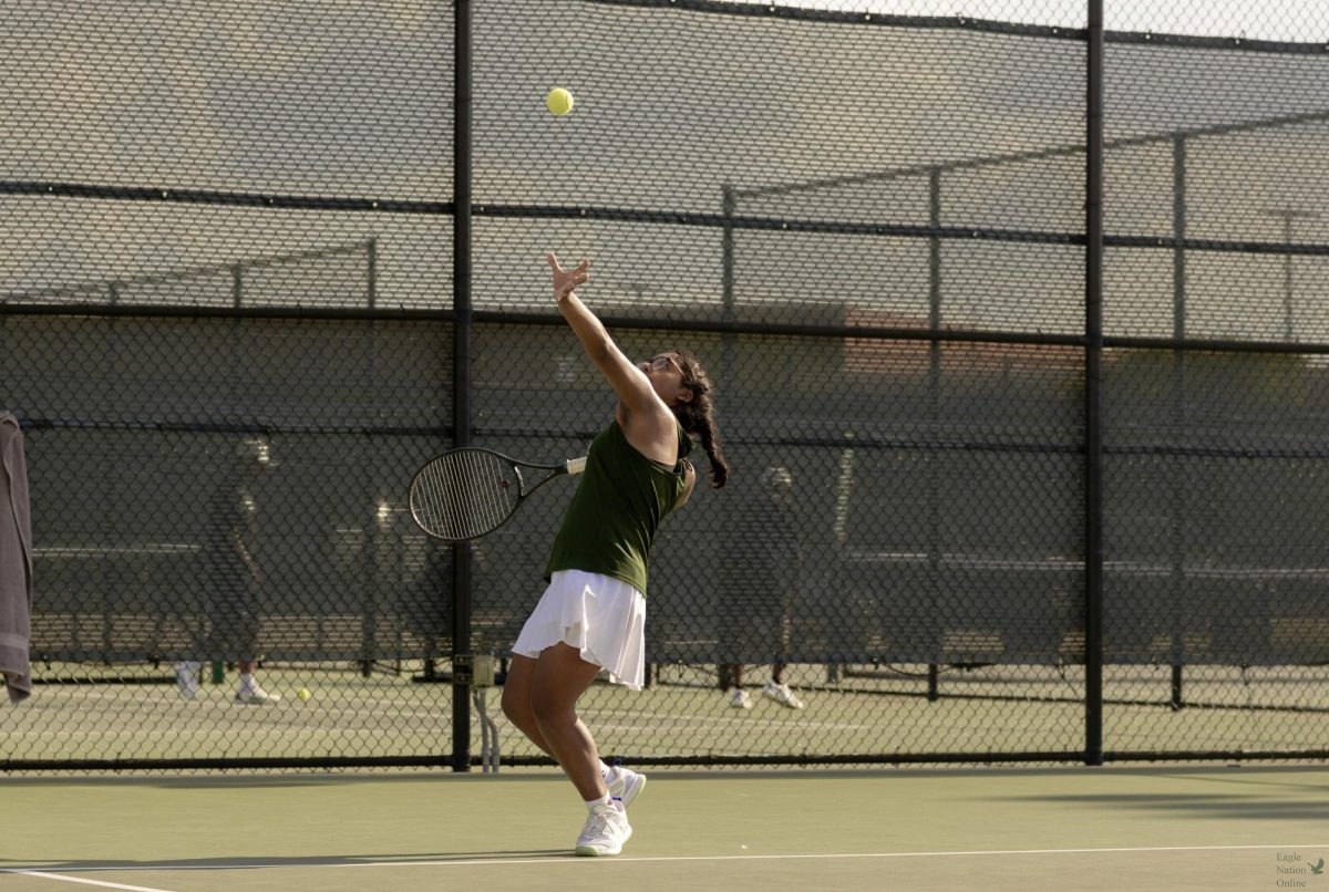 As she prepares for her next move, freshman Arshi Mehri serves the ball to the opponent without going out of bounds. This marks her first year being in the tennis program. Mehri plays doubles and singles. 