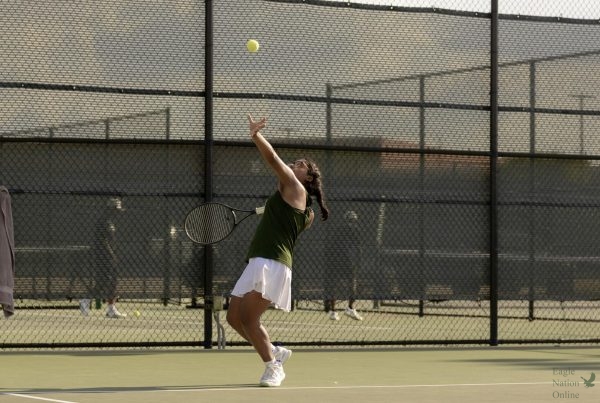 As she prepares for her next move, freshman Arshi Mehri serves the ball to the opponent without going out of bounds. This marks her first year being in the tennis program. Mehri plays doubles and singles. 