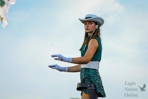 As she positions herself on the ladder, junior drum major and Talonnette Katie Lynn Sepper stands in front of the crowd and conducts the Prosper High School Might Eagle Band. This is Sepper's third year in the band and her second year on the dance team. "There are going to be hard things in life and you're not going to be able to do everything all the time. Just communicate," Sepper said. "The most rewarding part is inspiring others. 