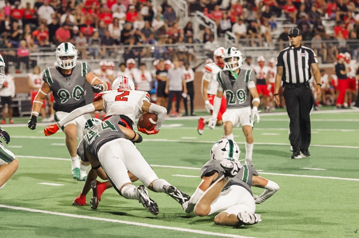 Arms out, senior Tayvin Labbe tackles a Rockwall Heath ball carrier. Labbe was a captain for this game where Prosper defeated Rockwall Heath 49 to 18. "I was really proud of how well as a defense we were able to adapt and adjust to their offense," Labbe said. "All week we were trying to prepare for something we wouldn’t be able to see and I think Friday night we executed and were able to read and react very well."