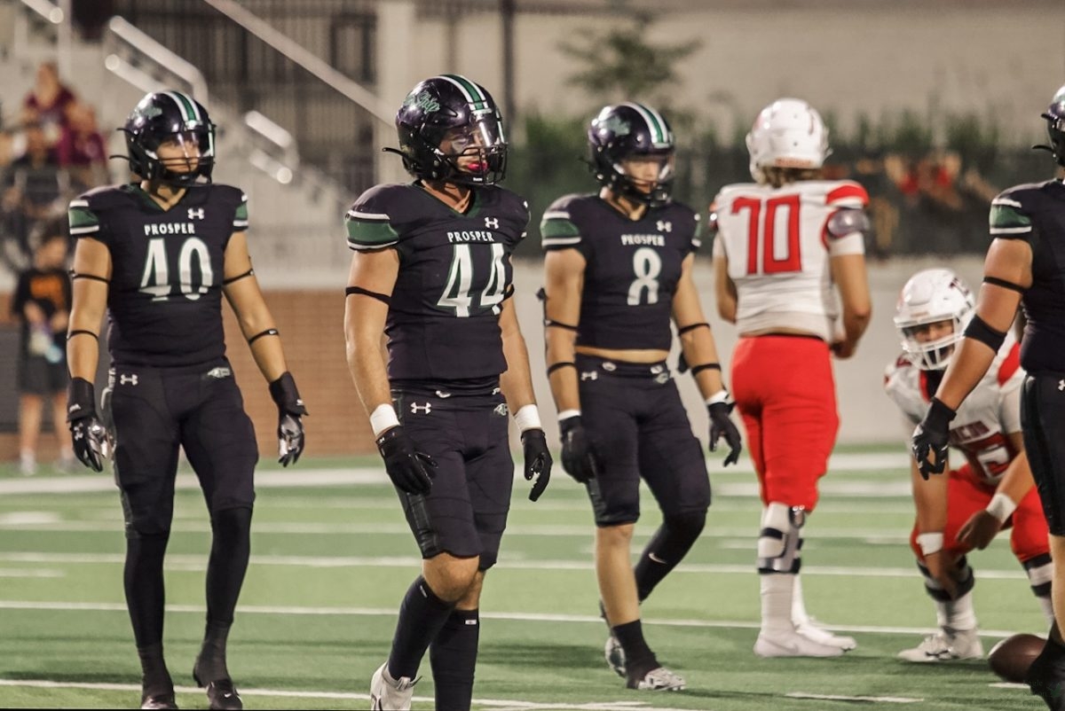 Defense on the field, senior Tayvin Labbe watches the sideline after the 2nd down play is over. Labbe plays as linebacker. Prosper played against the McKinney-Boyd Broncos Sept. 20 and defeated them 55-17.