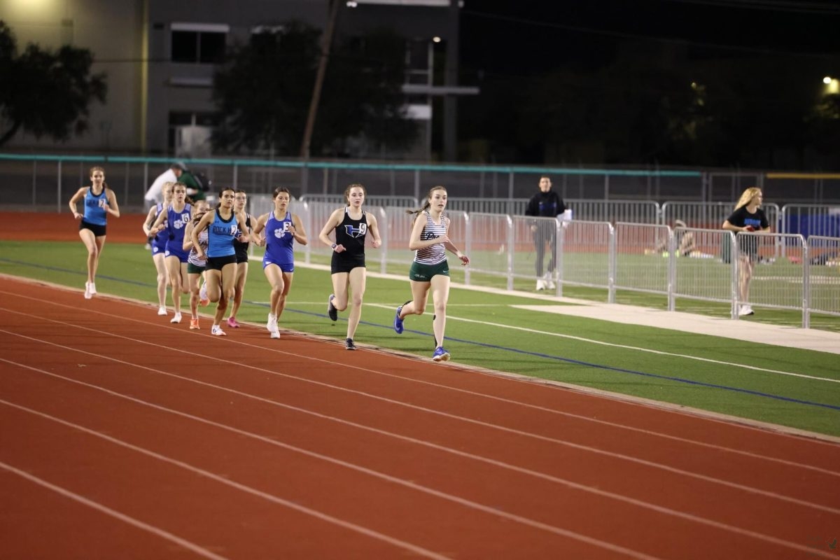 One foot in front of the other, senior Erin Young stays ahead of the race. This year marks her fourth year with the cross country and track program. 
“What I enjoy most about running cross country is the thing that I love most – the people, the people make it the best, like just having your friends alongside you. Even for those hard moments and those hard runs, they help you push through,” Young said. “Even when you're like thinking, oh my gosh, this sucks. This is hard, they're going through the same thing with you. And it just makes a close knit environment. Everyone is so happy all the time. So like, cross country is a really nice and, super sweet environment.”