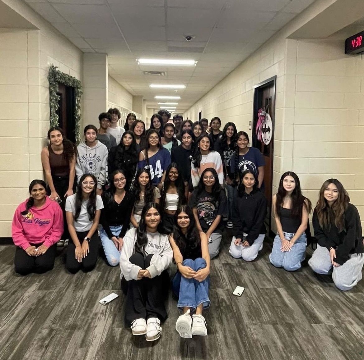 Junior and co–president of the Prosper Breast Cancer Awareness Club Dhruvi Tank (front right) sits with the club's other co-president Ananya Yerram (front  left) and the rest of the BCA team. The club's first introductory meeting this year was held on Sept. 5 to provide new members with a summary of the activities that will be held for the rest of the year. Breast cancer is the most cancer diagnosis in the United States and affects approximately 2.3 million individuals worldwide. 