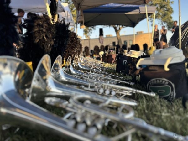 As they take a break, the Prosper high school band rests before their next performance. The band lines their instruments up when they are not in use. This instrument is called the mellophone (a marching French Horn).