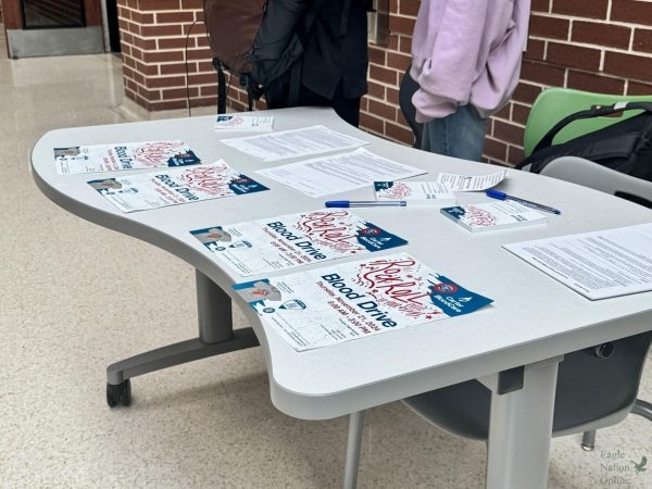 Ready for questions, HOSA's information table about the blood drive stands organized outside of the cafeteria during lunch. The table will be out two weeks prior to the event. "During lunches, like any lunch you have, you just go up to that table and then they'll give you more information," said sophomore Maryam Alshawi, HOSA member. "And you can make an appointment."