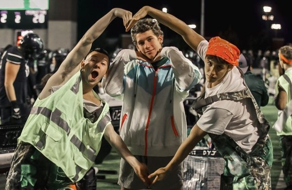 Arms in a heart, senior Nathanial Crabtree leads the student section in a cheer. The Eagles will play Plano West next on Nov. 7 at John Clark Stadium. The next game will be the last district match before heading off into playoffs. 