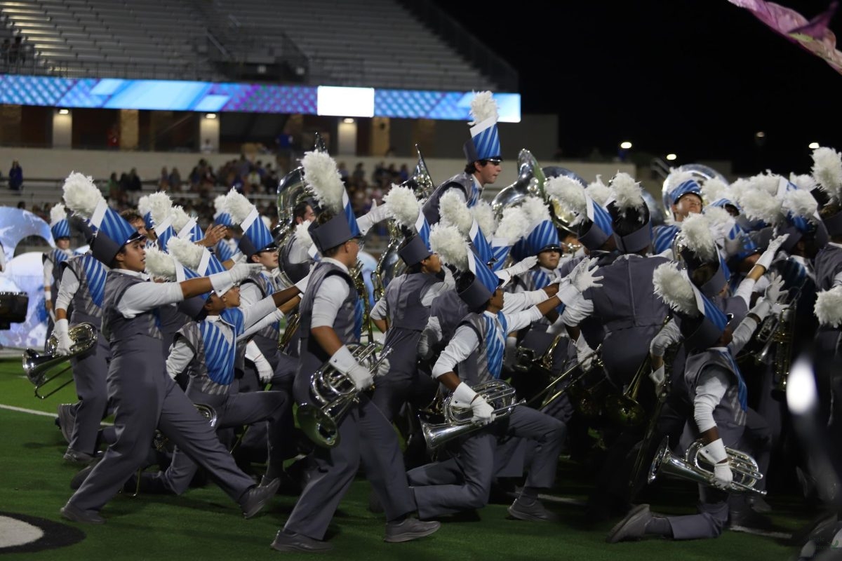 Performing as one, the Rock Hill Band plays in place of the Mighty Eagle Band on October 4th at Children's Health Stadium. The Rock Hill Pep Band will play stand tunes for the Prosper playoff game tonight. “Even with our friendly competition that all three schools have, we still want to make a clear message that all of Prosper ISD is still one,” Rock Hill drum major senior Maxwell Lee said. “Also, we understand the importance of Grand Nationals as a competition for the PHS band, so we want to support their trip and we wish them the best of luck.”