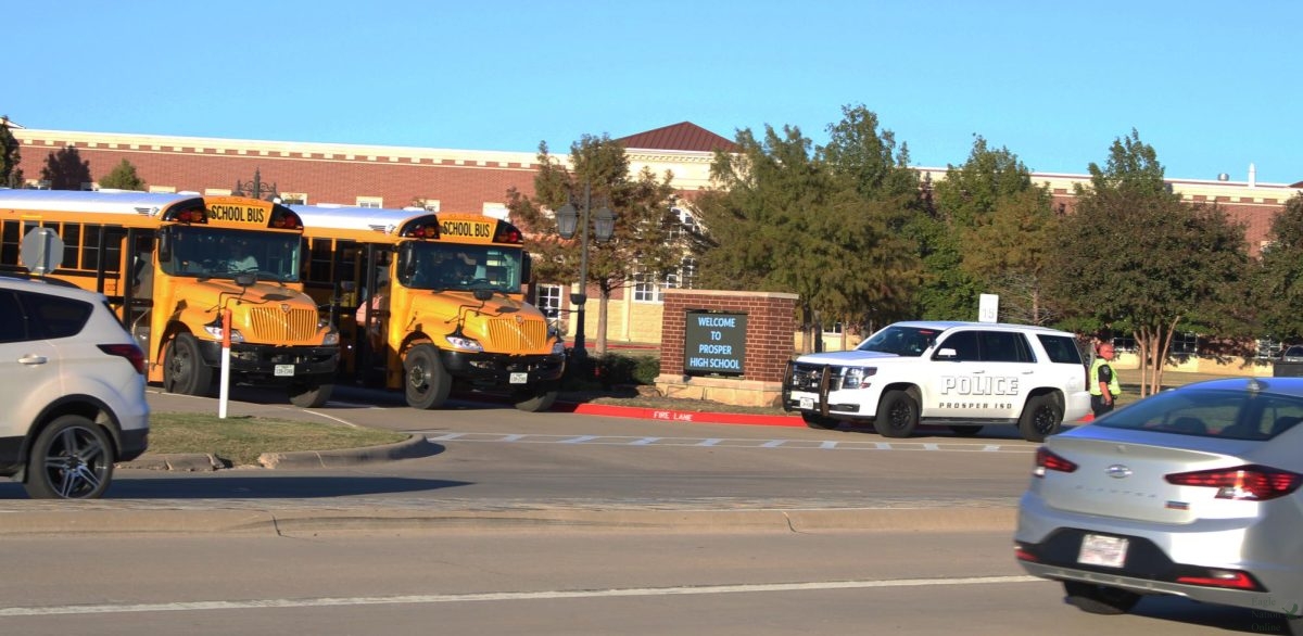 Overlooking the main entrance of Prosper High School, Sgt. Christopher Reeves creates a break to allow for the buses to leave the campus at the end of the school day. Without officer intervention, the bus drivers have a difficult time leaving the parking lot. "It's the best set up that we can possibly offer," Reeves said. "We've had years where buses lined up in front of the cafeteria, and they all exited Frontier (Park)."