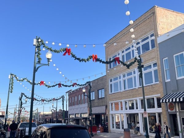 With Christmas decorations hanging over a street in Downtown McKinney, photographer Kate Duncan shops with her mom. McKinney adorns their town with festive apparel every December. "I love Downtown McKinney during the holidays," Duncan said. "The energy of the town is so nice. I love visiting with my mom during any time of the year."