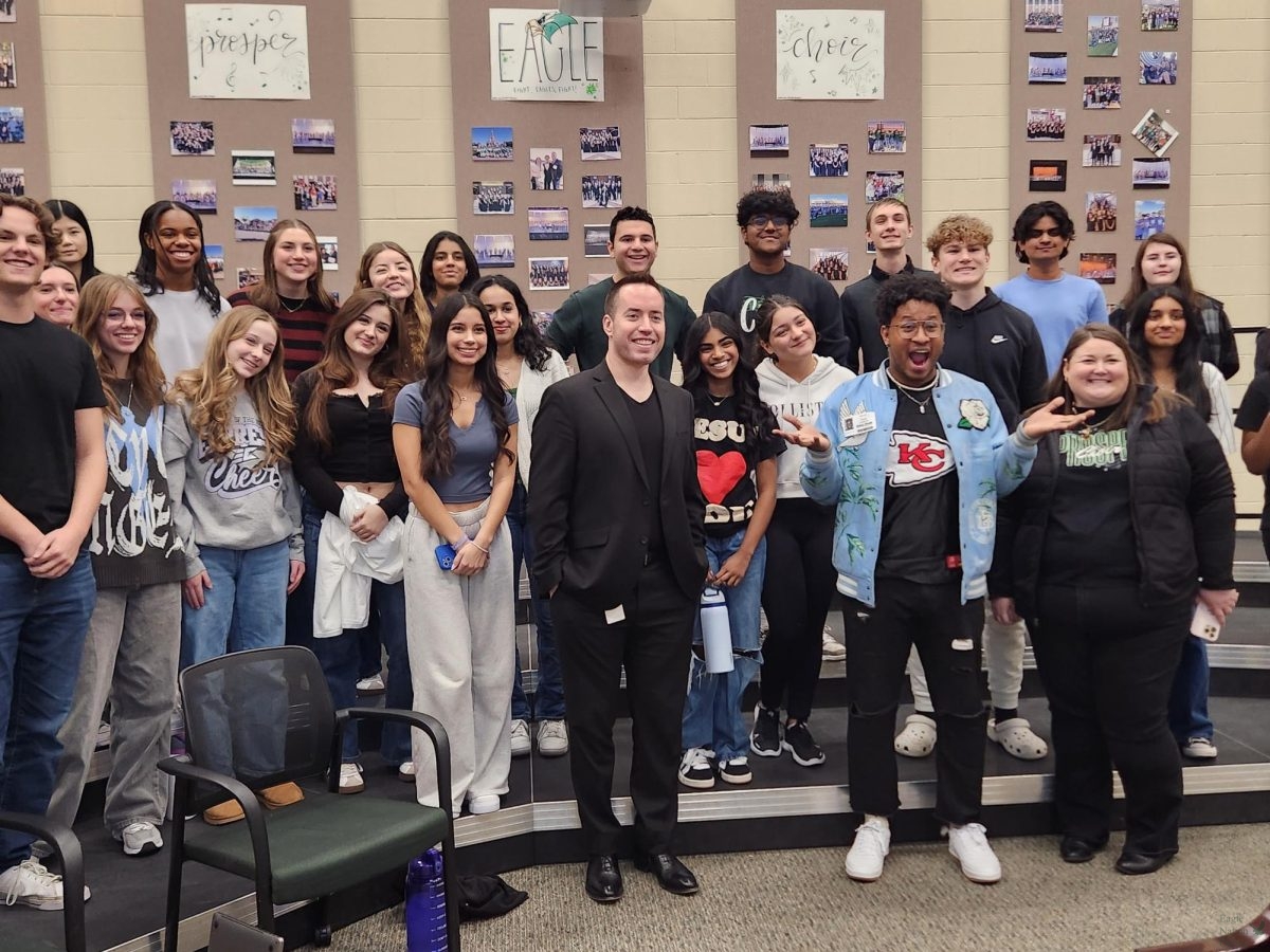 In the back row, from left to right, is junior Ava Oh, seniors Caroline Conzelman and Imri Lanier, sophomore Gabi Skerianz, senior Nicole Skerianz, sophomore Meena Vasudevan, seniors Brandon Rodriguez and Adithya Garneni, junior Carson Lucas, sophomore Aditya Murthy and senior Eliza Sutton. On the second row from left to right is seniors Aiden Hansen and Olivia Merrill, junior Isabella Hoye, sophomores Grace Hargis and Sophie Landrith, junior Khyati Khanderao, sophomores Sosanna Jacobs and Alanys Aviles Barbosa, and juniors Justin Alfano and Anubis Yerram. In the front row, from left to right, are choir director Tate Keen, Isaiah Johnson, and choir director Crystal Chamberlain.