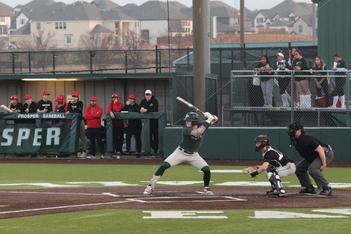 At the bat, senior Kaden Robardey prepares to hit the baseball. Robardey plays outfield and is No. 4 on the team. His pre-game ritual is chewing green or white gum, and his favorite athlete is Bryce Harper. The varsity team will play against Quinton Creek this Thursday, Feb. 27, at the Prosper High School Baseball field. The game will start at 3:30 p.m. 