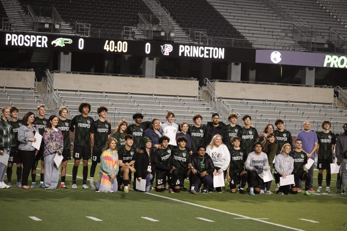 Before the game, the soccer team takes a moment to appreciate their teachers. The players gather for a group photo with their teachers, showing gratitude for their support. This special moment highlights the team’s appreciation and the important role their teachers play in their lives.

