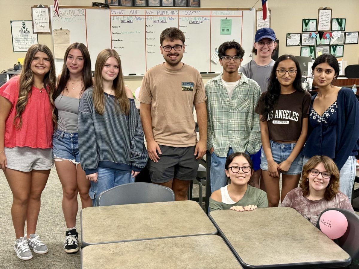 Members of the 2025-26 Eagle Nation Online newspaper, along with graduate Chief Executive Officer Jake Radcliffe (middle). This year, there are 26 members on team 