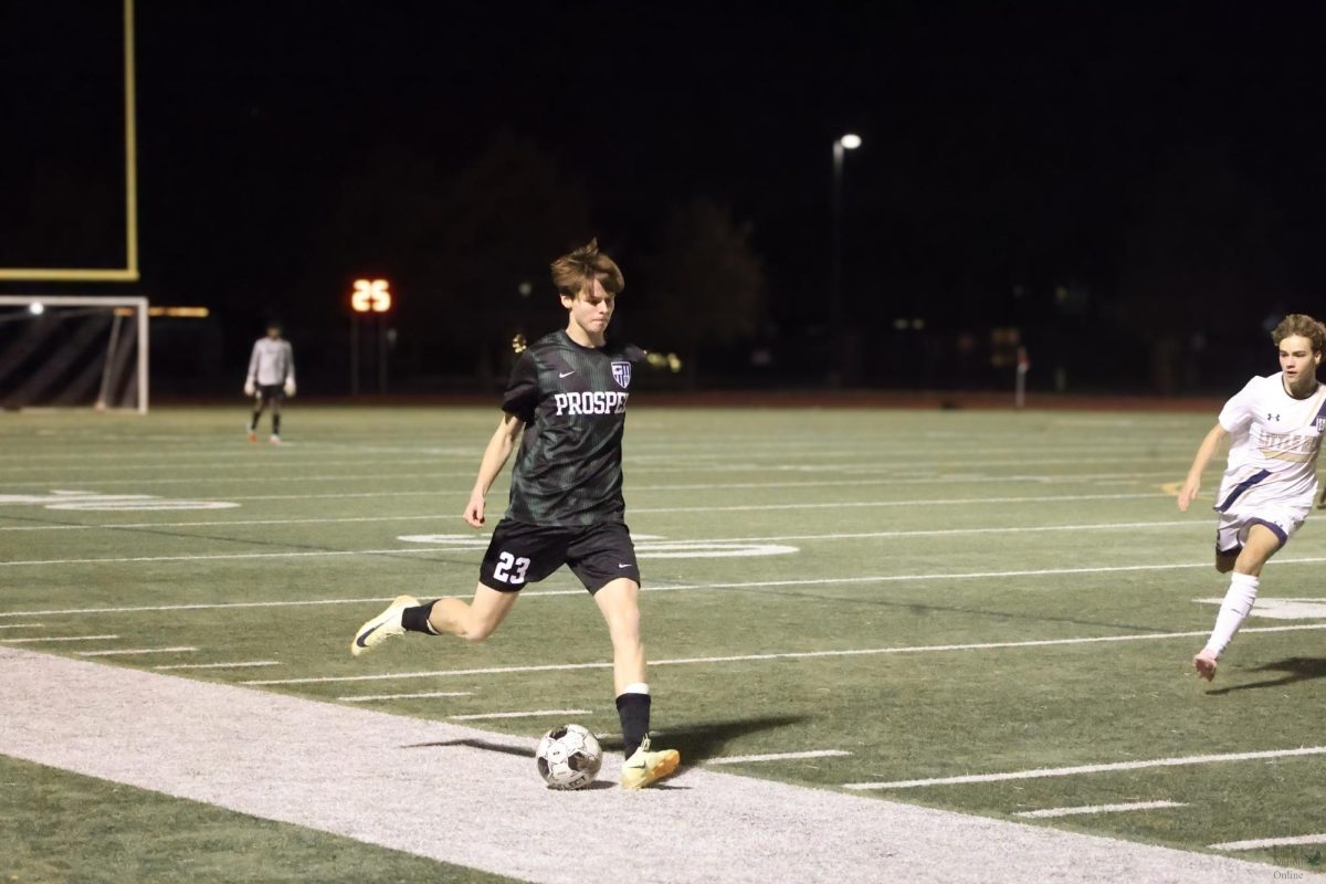 One foot in front of the other, junior Liam Barry prepares to kick the ball. This is Barry's first year on the junior varsity team. The next game will be away against Duncanville.