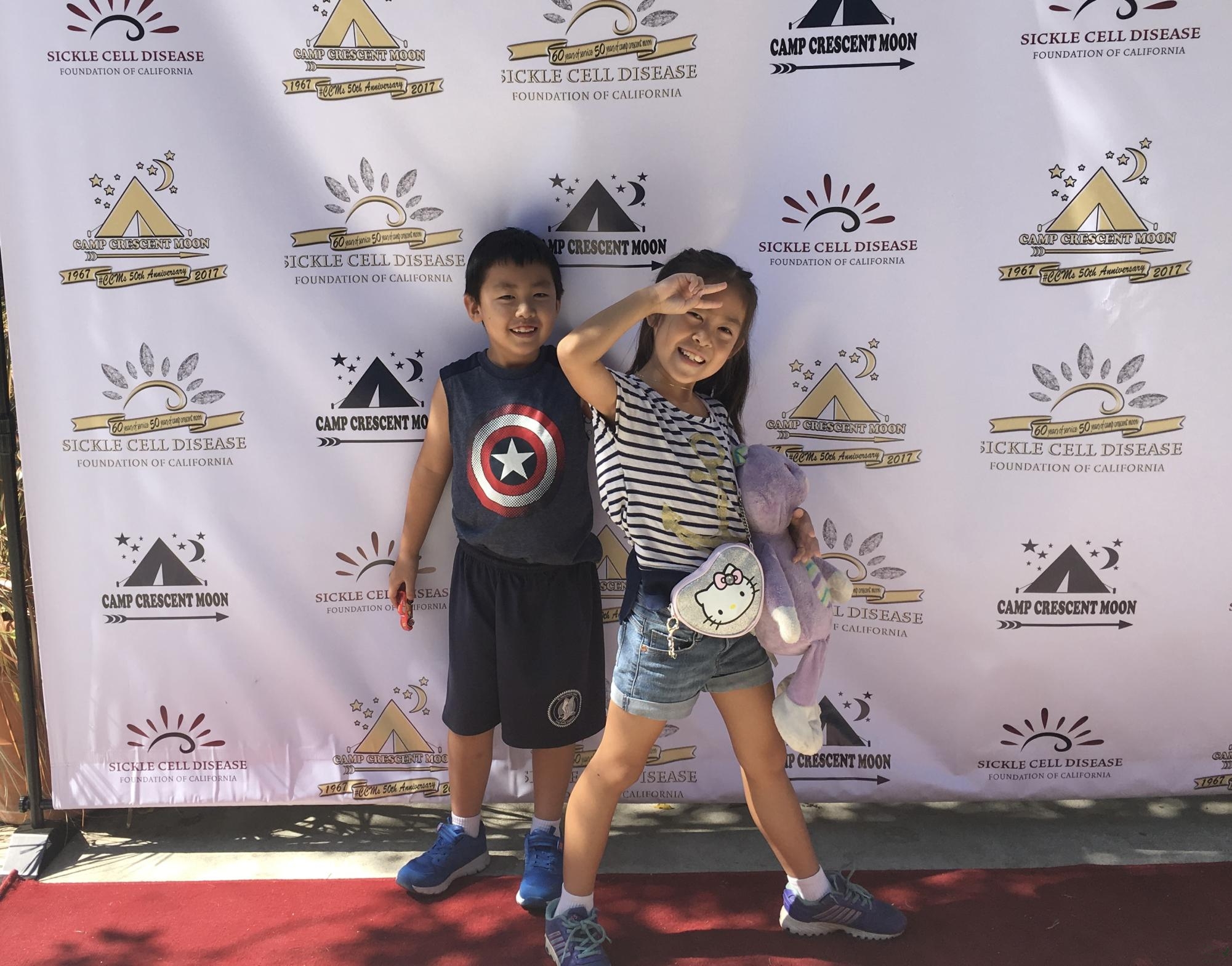 Posing for a photo, junior Grace Suzuki poses with their brother at Camp Crescent Moon. Their father volunteered at the camp and help the kids with their daily activities, while bringing his children to the camp. The family still holds strong connections with each other and the camp. (Courtesy of Russell Suzuki, Grace's father).