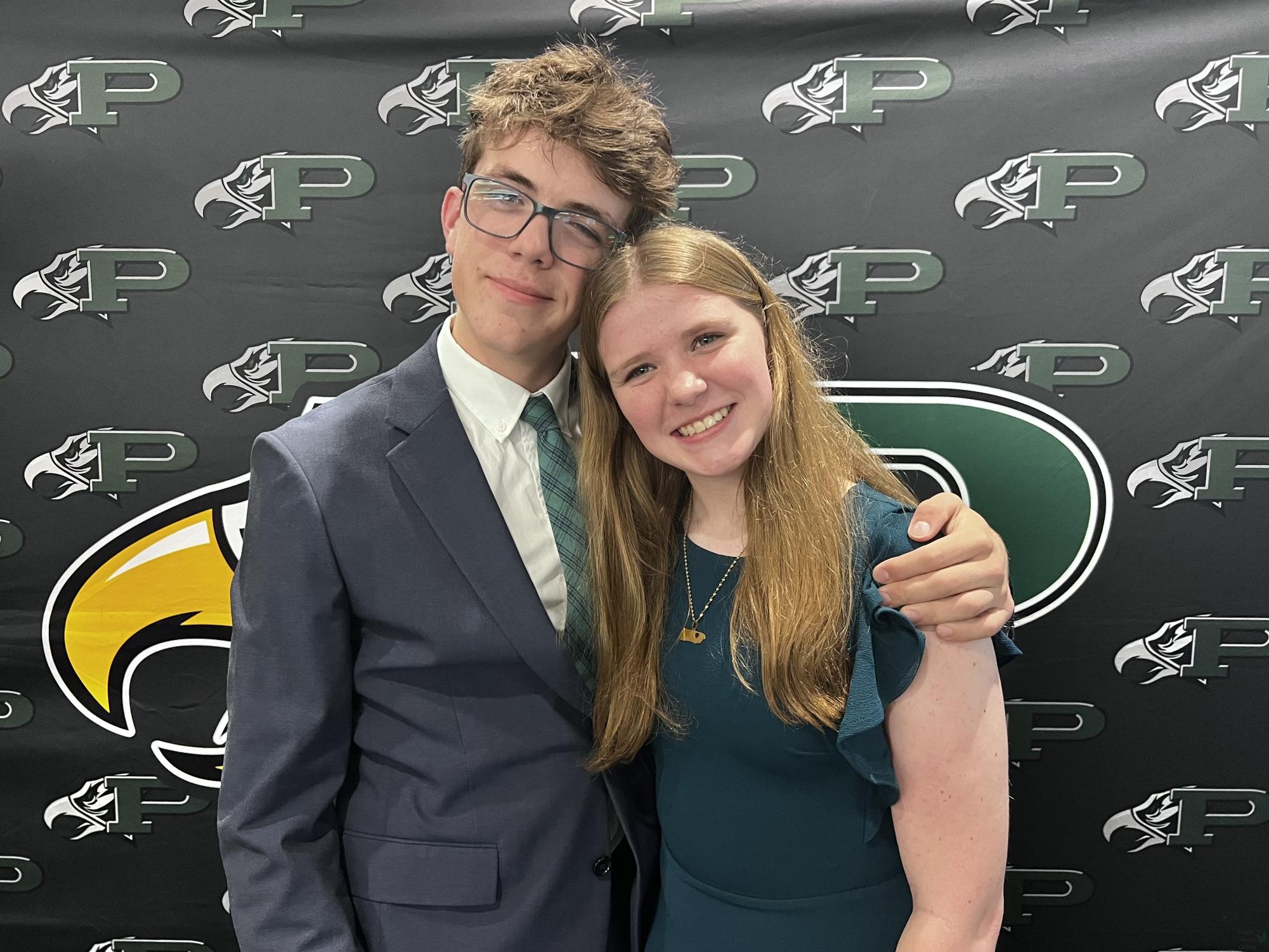 Arm around her shoulder, senior Jude Greaves hugs sophomore Polly Greaves. The cross country banquet was Nov. 18. Jude participates on the Varsity team. 