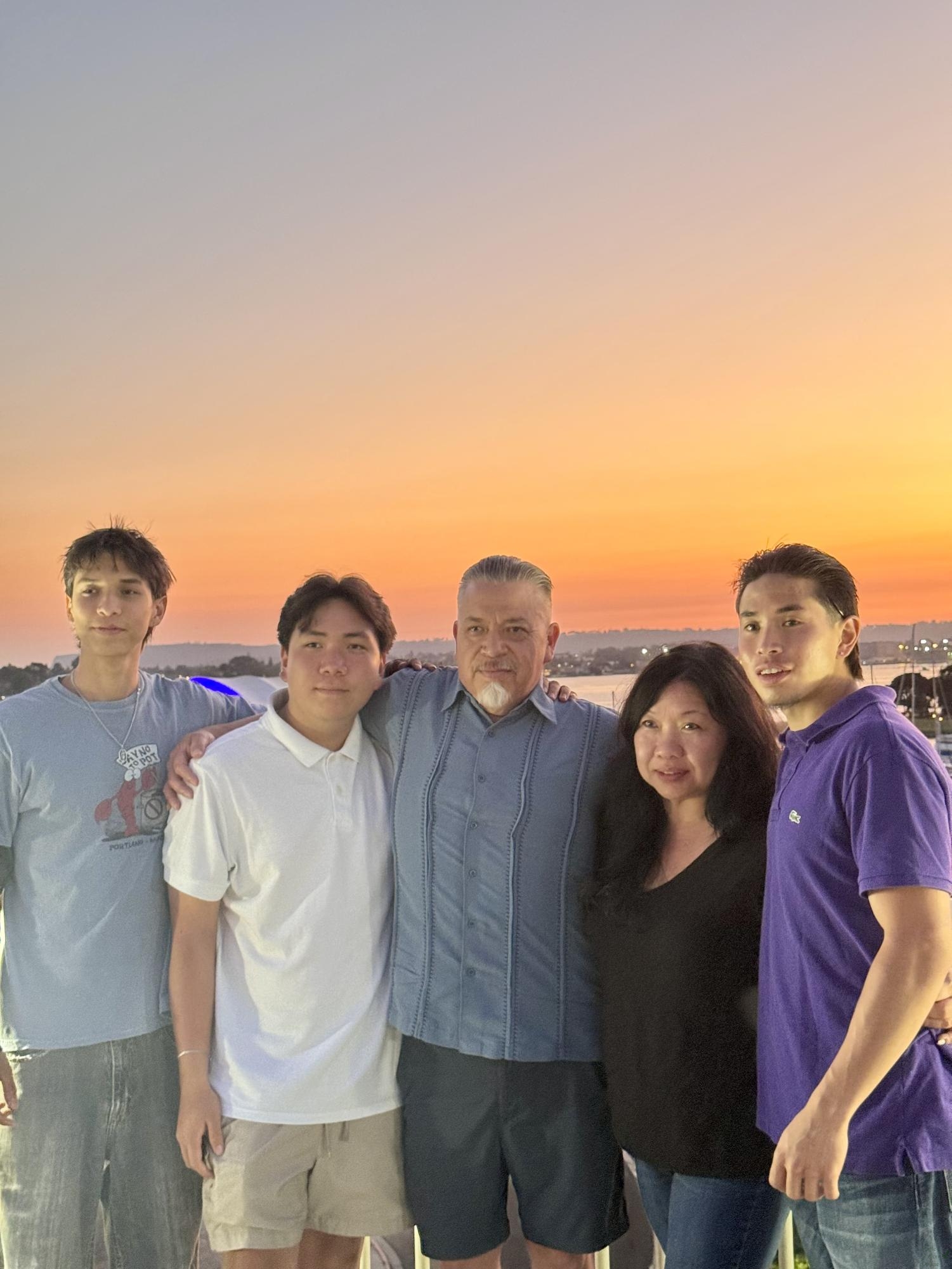 Taken in San Diego, Ca, Johnathan Tristan's family poses for a family photo. Johnathan talks about the potential challenges with parents but how it is all for love. He says, "They want me to be the best that I can." Tristan says, "Although this can involve small fights and minor disagreements with them, it feels good overall to know that someone is able to care about me like they do."