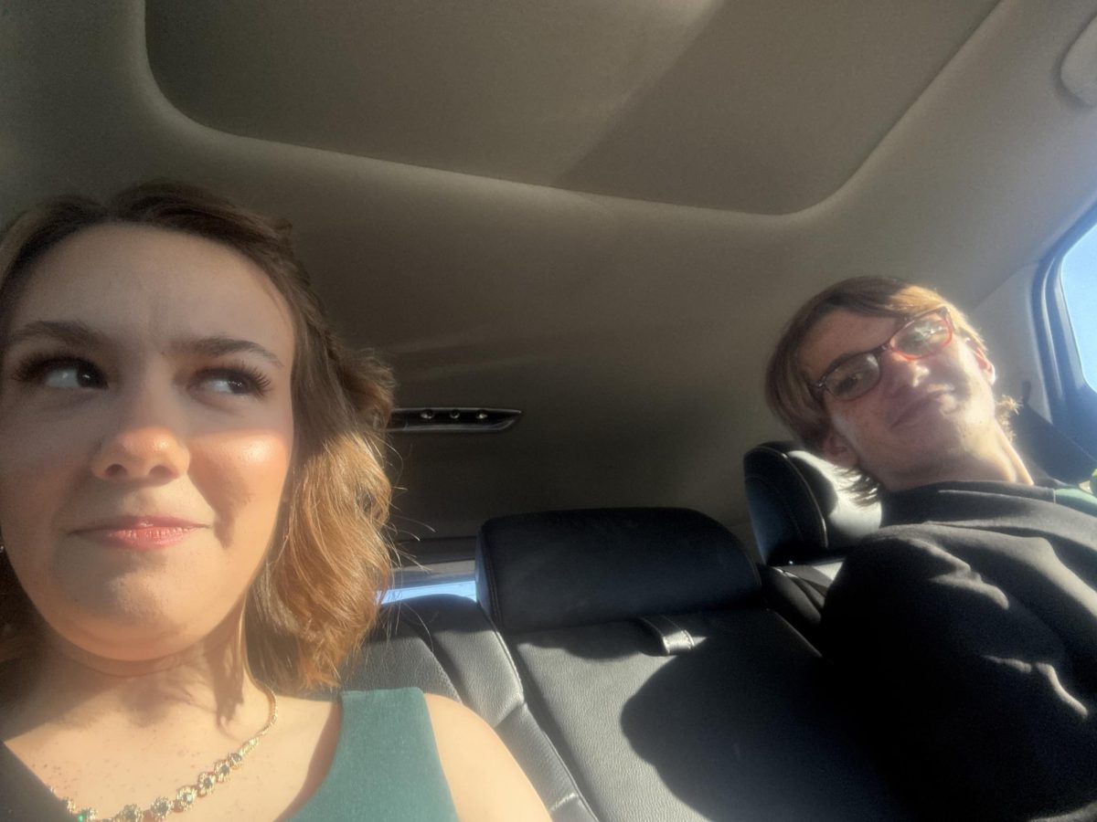 Driving down the road, seniors Emily Logan and Cole Bursing make their way to the homecoming dance. The two have been in a relationship for a little over a year. “I am so grateful that he loves me so much,” Logan said. “I really don’t know what I would do without him.” 