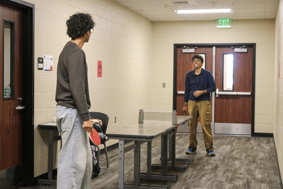 Preparing to take the next shot, senior Tanish Chauhan plays ping pong with his friend, senior Aarush Kangokar. Chauhan has 62 Minga points in total and was, therefore, invited to Minga Day. "Minga Day was a nice and silly break from the start of second semester as a senior," Chauhan said. "Ping pong was a great way to spend time with my friends."