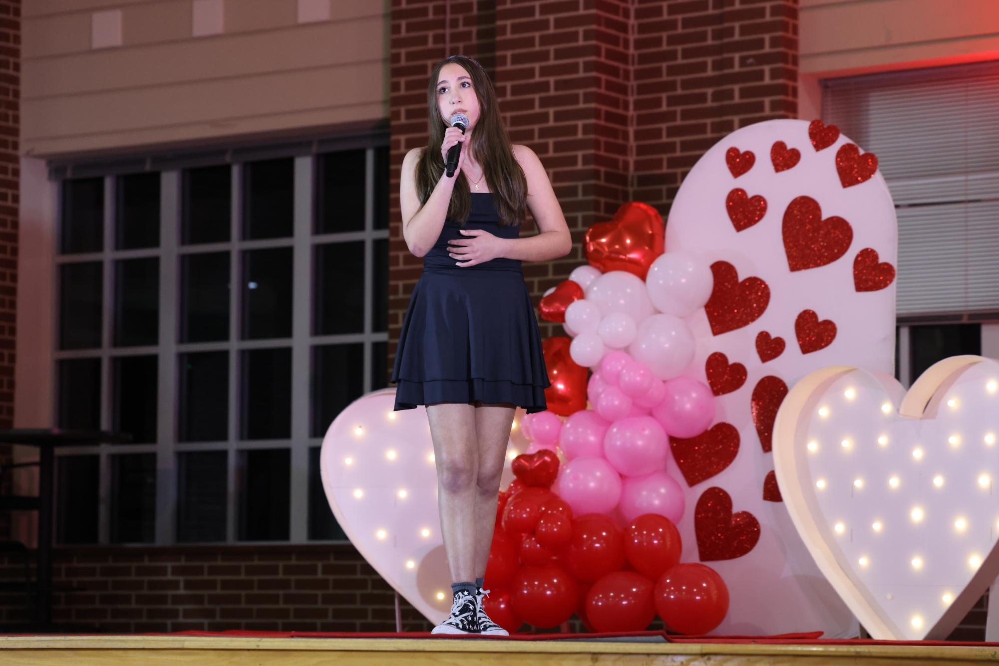 Walking around the stage, freshman Ariana Nasery holds the microphone with one hand and looks out to the crowd. Napery performed "Mr. Electric," according to the 2026 setlist. There were 12 solo performances out of the 20 total.