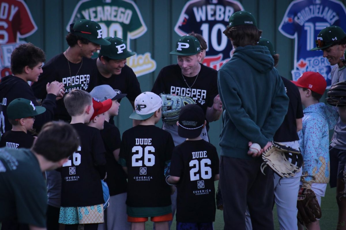 Huddling together before a mini game, freshmen Connor Chastain, Mason Yoo-Tritt and sophomore Andrew Hoye converse with the youth participants. All three are members of the JV baseball team. "I think the event went really well, it was a good turnout, and I think the kids had a good time and that's what it's all about," Cooper Duncan, junior, JV baseball team member said. "I'm most excited to get going, being around my teammates and having a good season."