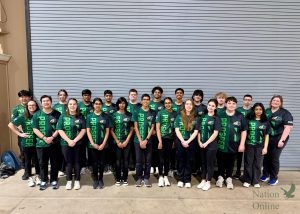 Looking ahead, the PHS archery team stands posing for a picture. The team attended the State Competition in March, coming home with many personal bests. They will compete at Nationals in April. 