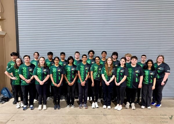 Looking ahead, the PHS archery team stands posing for a picture. The team attended the State Competition in March, coming home with many personal bests. They will compete at Nationals in April. 