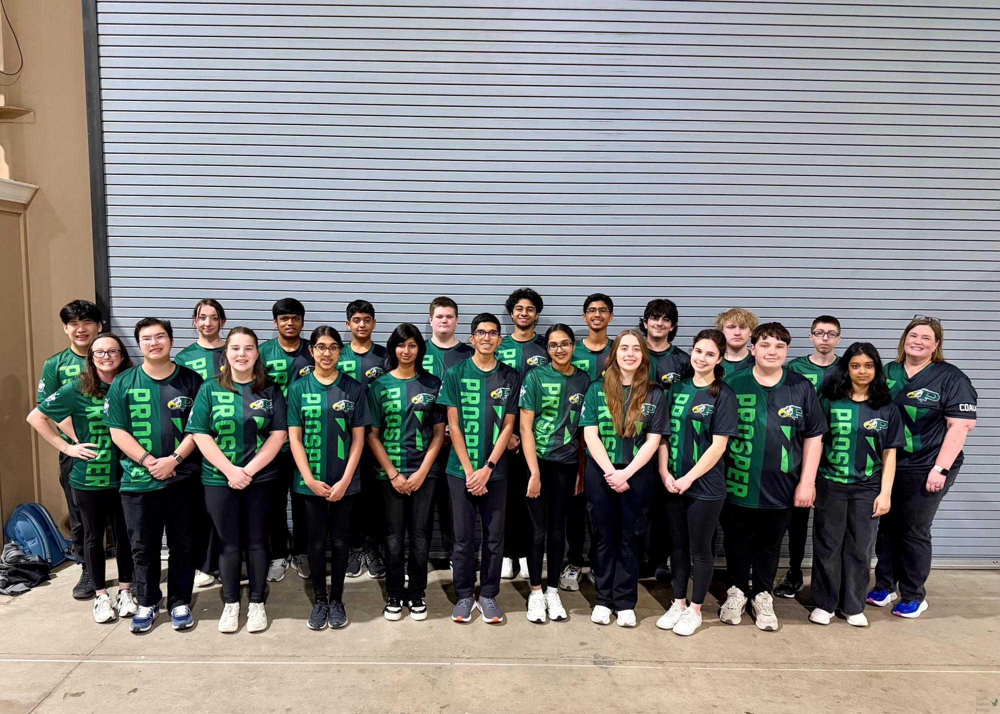 Looking ahead, the PHS archery team stands posing for a picture. The team attended the State Competition in March, coming home with many personal bests. They will compete at Nationals in April. 