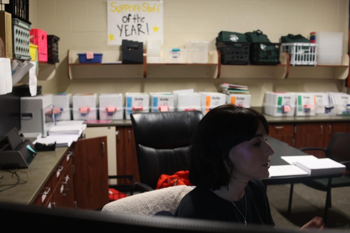 Speaking to a student, PHS Testing Coordinator Courtney Langdon prepares for STAAR testing.Following the altered bell schedule, testing will be over by 2:45. "I make sure everything's ready for the test." Langdon said. "I train all the teachers, get all the rooms ready, get all the materials ready, get all the data ready."
