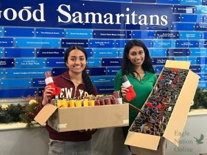 Smiling at the camera, seniors Adithri Raghuram and Riti Patel hold boxes filled with peppermints, coloring books toys to distribute to students later. Supplying Smiles has reached over 20 states and their schools. "We chose to address educational inequity through these means as school materials are accessible, meaning with fundraised money, we can easily purchase them," Raghuram said. "I love watching people’s faces light up and seeing that our impact makes a difference."