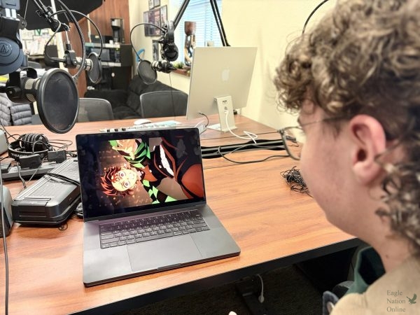 Staring at screen intensely, sophomore Ethan Chatelain watches anime movie "Demon Slayer: Kimetsu no Yaiba Infinity Castle" that is nominated at the Crunchyroll Anime Awards for 2026. The film is running for Film of the Year against nominees including "100 Meters," "Chainsaw Man - The Movie: Reze Arc," and "Scarlet." Voting for the awards ends April 15, and the ceremony will take place May 23.