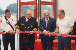 Holding a fire hose to act as a ribbon, Assistant Fire Chief Shaw Eft, Fire Chief Stuart Blasingame, Mayor David Bristol and Town Manager Mario Canizares prepare to officially launch Fire Station 4. The department opened its doors to the public on April 28 at 3 p.m. "If there's a lightning strike, we can get an engine to that site location quicker," Bristol said. "Chief Blasingame is manning the station with a fire engine paramedic crew, so on that engine, it can handle any paramedic need as well as fighting a fire."