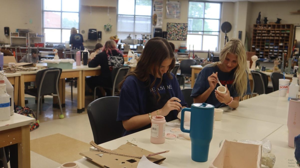 As they paint their ceramic pieces in the art room, juniors Shallyn Hopkins and Libby Allen work to finish their projects before summer break. Earlier in the week, the class wrapped up their final assignments. “I’m just glad to be done,” Hopkins said. “I can’t wait to see how they look after firing.”