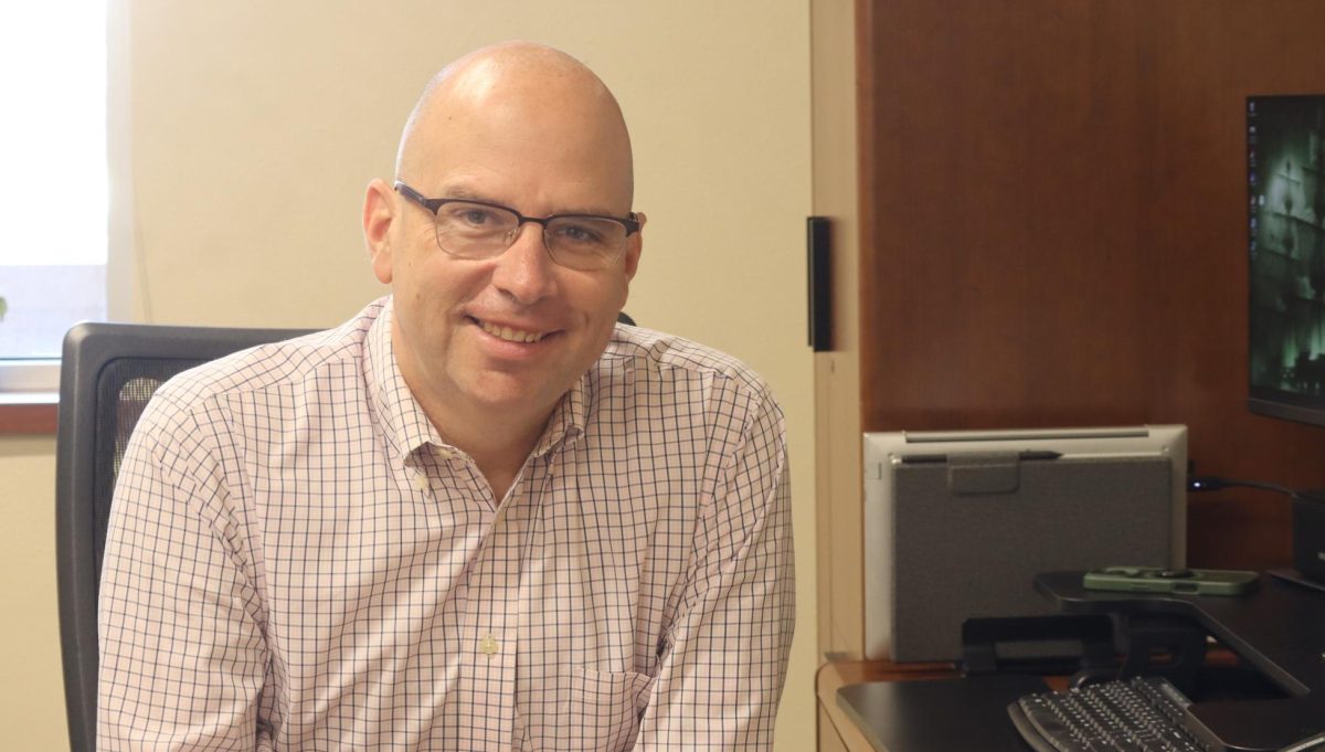 Beaming ahead, assistant Jimmy Frideley takes a break from his work. Frideley has been an AP for the past three years and at PHS for six. He taught social studies and special education before becoming an assistant principal.
