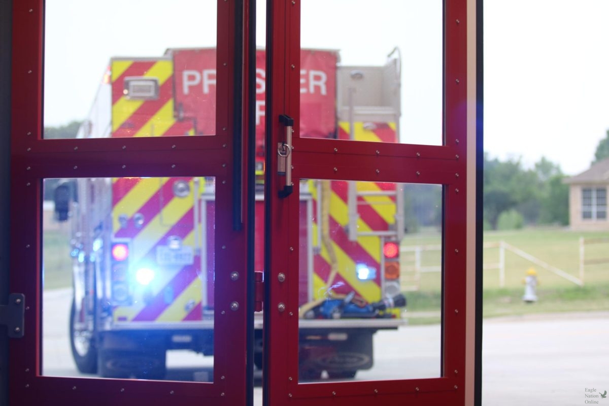 Blue and red lights flashing, a fire truck leaves in the middle of the ceremony to respond to a nearby emergency. The alarm sounded and the ceiling monitors flashed, notifying firefighter paramedics who left instantly. Later, the fire truck came back and attendees pushed it back into the station as a tradition, symbolizing the final step of the ceremony.